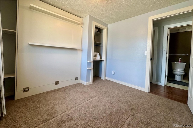 98 Baylor Dr, Buena Vista, CO 81211 - unfurnished bedroom featuring carpet flooring, baseboards, a textured ceiling, and a closet