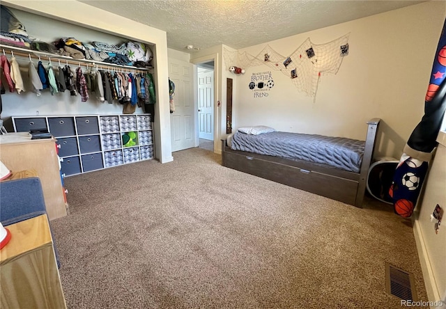 98 Baylor Dr, Buena Vista, CO 81211 - bedroom with carpet flooring, a closet, and a textured ceiling