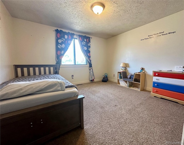 98 Baylor Dr, Buena Vista, CO 81211 - bedroom featuring a textured ceiling, carpet floors, and baseboards