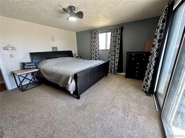 98 Baylor Dr, Buena Vista, CO 81211 - bedroom with light colored carpet, a textured ceiling, and ceiling fan