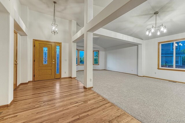 1838 Mountain Daisy Ct, Highlands Ranch, CO 80129 - foyer entrance with a chandelier, light wood-style flooring, and baseboards