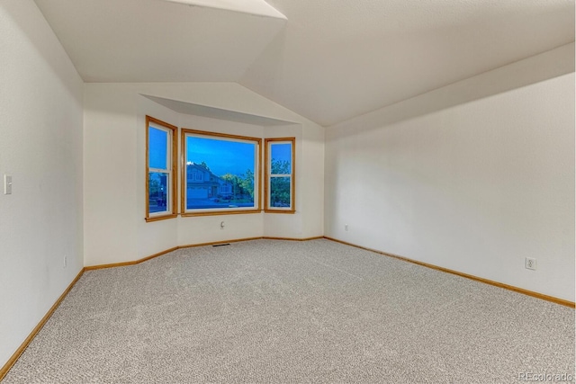 1838 Mountain Daisy Ct, Highlands Ranch, CO 80129 - unfurnished room with carpet floors and lofted ceiling
