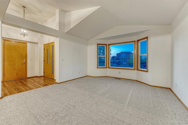 1838 Mountain Daisy Ct, Highlands Ranch, CO 80129 - carpeted spare room with vaulted ceiling and a chandelier
