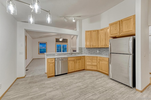 1838 Mountain Daisy Ct, Highlands Ranch, CO 80129 - kitchen with appliances with stainless steel finishes, light countertops, a sink, backsplash, and light wood-style flooring