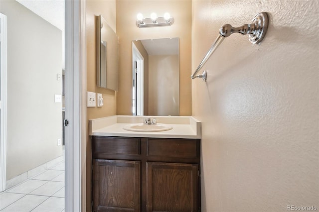 bathroom with vanity and tile patterned floors