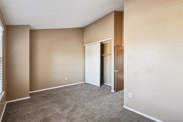 unfurnished bedroom featuring carpet floors and a closet