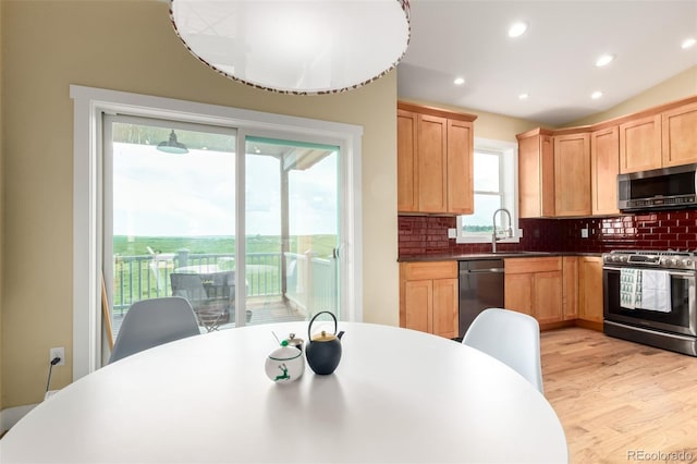19500 Wedemeyer Rd, Kiowa, CO 80117 - kitchen featuring appliances with stainless steel finishes, light brown cabinetry, decorative backsplash, light wood finished floors, and recessed lighting