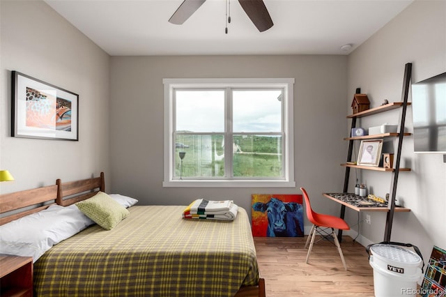 19500 Wedemeyer Rd, Kiowa, CO 80117 - bedroom featuring wood finished floors, multiple windows, and ceiling fan