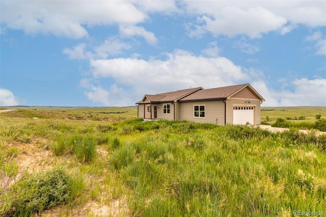 19500 Wedemeyer Rd, Kiowa, CO 80117 - view of home's exterior featuring an attached garage and a rural view