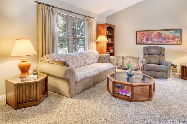 living room with lofted ceiling and carpet floors