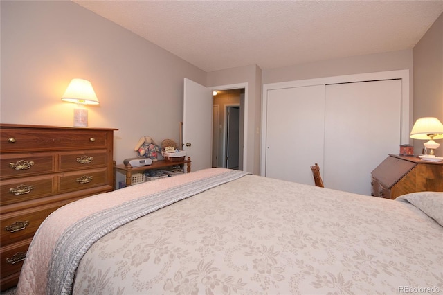 bedroom with a closet and a textured ceiling