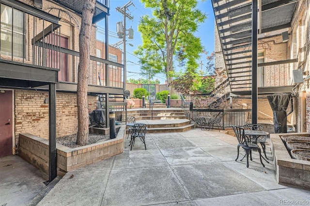 view of patio featuring stairway