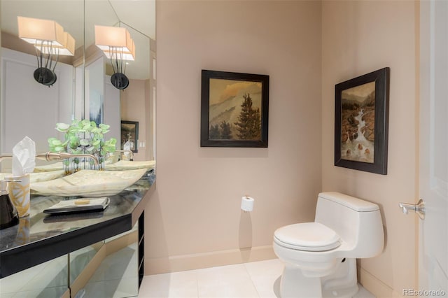 bathroom featuring vanity, toilet, and tile patterned floors