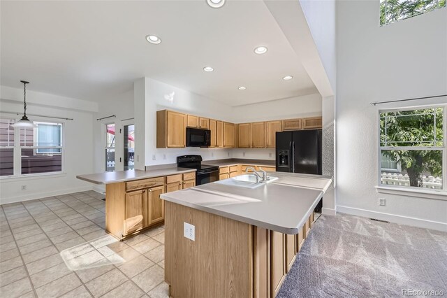 3514 E 141st Dr, Thornton, CO 80602 - kitchen with black appliances, healthy amount of natural light, light countertops, recessed lighting, and a peninsula