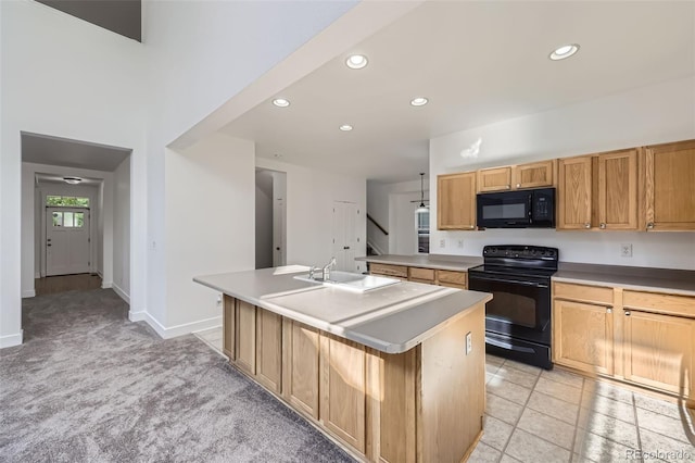 3514 E 141st Dr, Thornton, CO 80602 - kitchen featuring black appliances, a center island with sink, recessed lighting, and light carpet