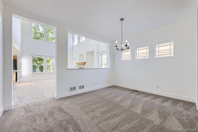 3514 E 141st Dr, Thornton, CO 80602 - empty room with carpet flooring and a chandelier