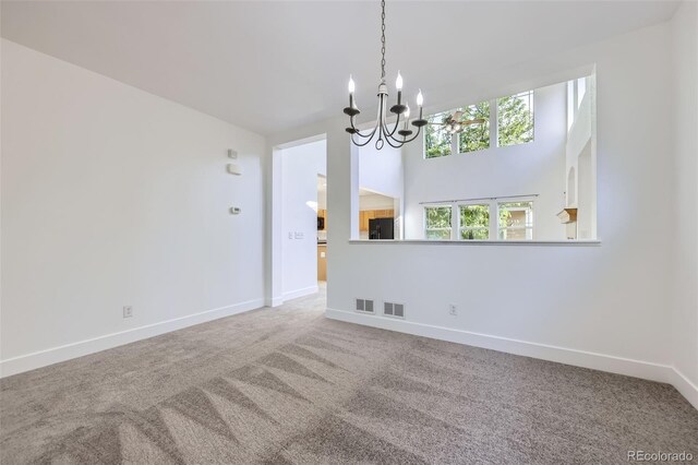 3514 E 141st Dr, Thornton, CO 80602 - unfurnished dining area with a chandelier and carpet