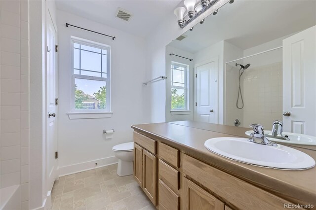 3514 E 141st Dr, Thornton, CO 80602 - bathroom featuring vanity, plenty of natural light, and shower / bath combination