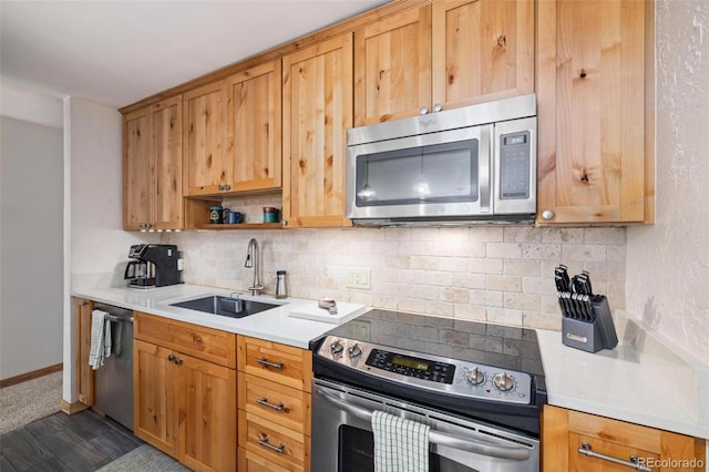 805 Columbine Rd Unit 202, Breckenridge, CO 80424 - kitchen with stainless steel appliances, a sink, tasteful backsplash, light countertops, and baseboards