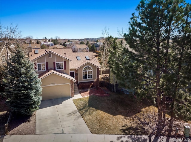 view of front of house featuring a residential view, concrete driveway, and a garage