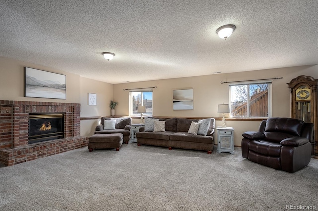 carpeted living area with a healthy amount of sunlight and a fireplace