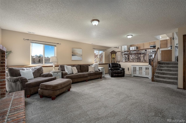 living room with stairs, visible vents, and carpet flooring