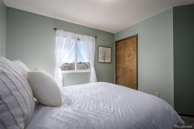 bedroom featuring a closet and a textured ceiling