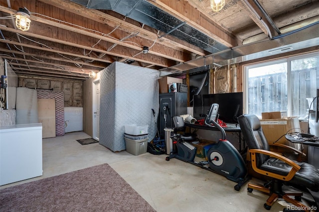 basement featuring fridge