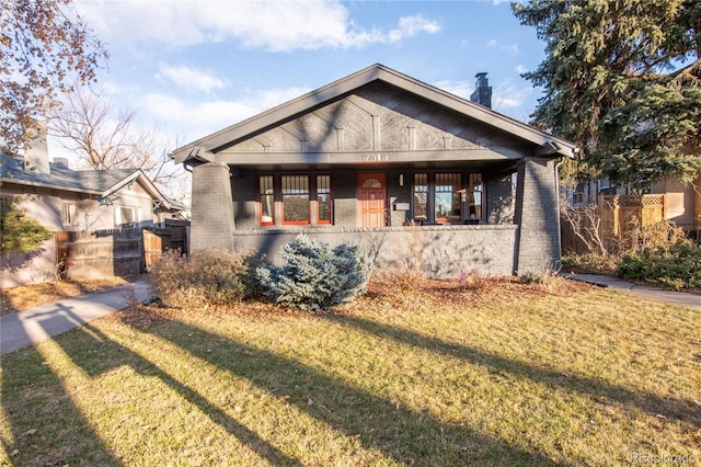 bungalow-style home featuring a front lawn