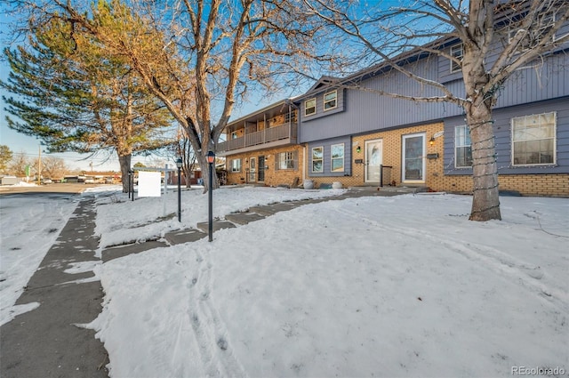 view of snow covered house