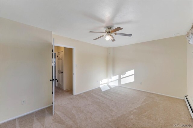 carpeted empty room with ceiling fan and baseboard heating