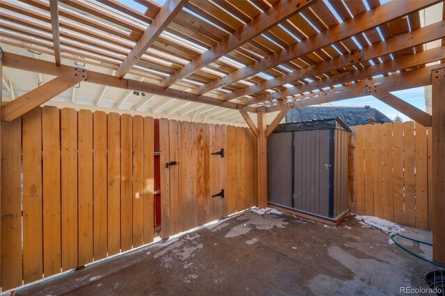 view of patio / terrace with a storage shed