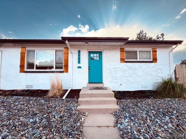 4435-4455 Elizabeth, Denver, CO 80206 - view of front of house featuring brick siding and crawl space