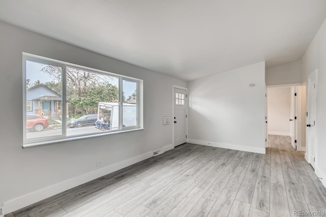 4435-4455 Elizabeth, Denver, CO 80206 - entryway featuring light wood-style flooring and baseboards