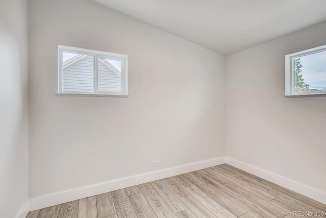 4435-4455 Elizabeth, Denver, CO 80206 - unfurnished room featuring baseboards and light wood-style flooring