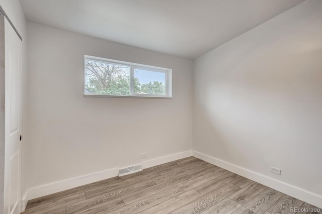4435-4455 Elizabeth, Denver, CO 80206 - empty room featuring light wood-type flooring and baseboards