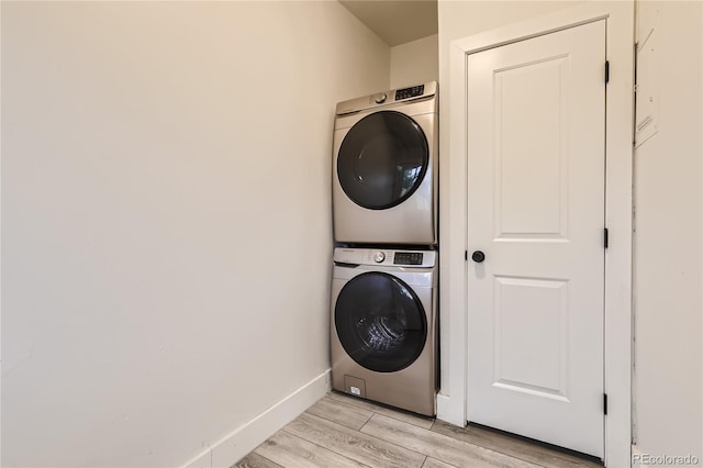4435-4455 Elizabeth, Denver, CO 80206 - laundry room featuring stacked washing machine and dryer and light wood-type flooring