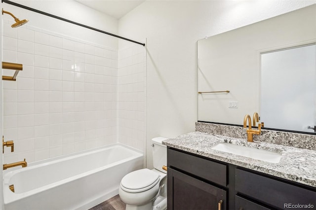 full bath with shower / bath combination, vanity, toilet, and wood finished floors