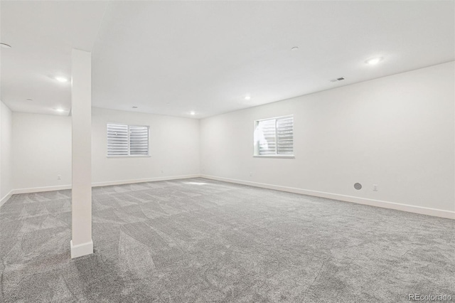 below grade area featuring carpet, baseboards, and recessed lighting