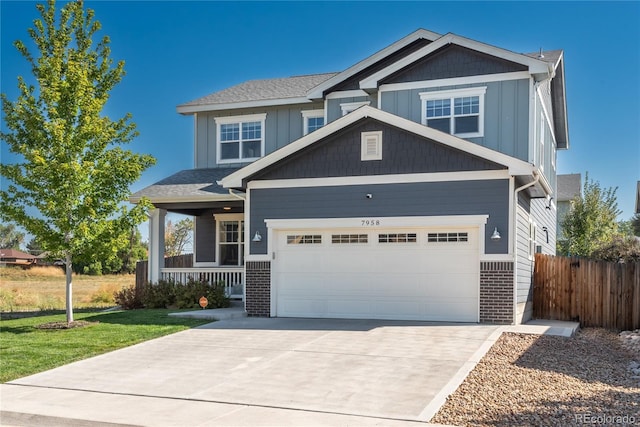 craftsman house featuring concrete driveway, board and batten siding, covered porch, fence, and brick siding