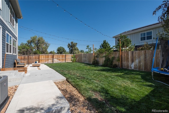 7958 Tejon St, Denver, CO 80221 - view of yard with a trampoline, a patio, and central AC unit