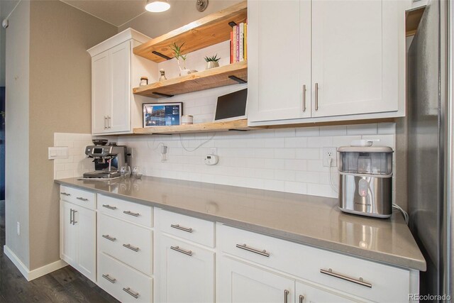 kitchen featuring open shelves, dark wood-type flooring, light countertops, white cabinets, and tasteful backsplash