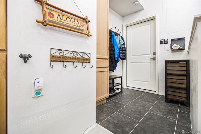 interior space with dark tile patterned floors