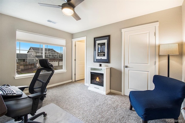 8395 E 132nd Pl, Thornton, CO 80602 - office area with a ceiling fan, carpet, baseboards, and a lit fireplace