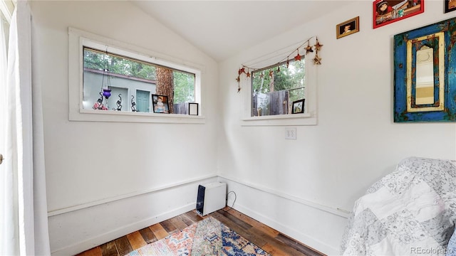 10990 Oehlman Ave, Conifer, CO 80433 - sitting room with vaulted ceiling and wood finished floors