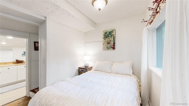 10990 Oehlman Ave, Conifer, CO 80433 - bedroom with wood finished floors and ensuite bathroom