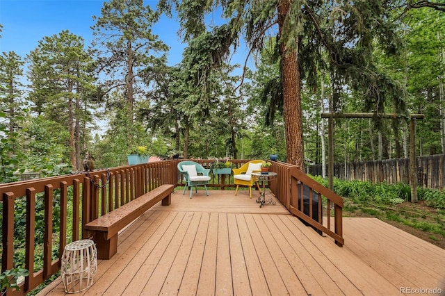 10990 Oehlman Ave, Conifer, CO 80433 - wooden deck featuring view of wooded area