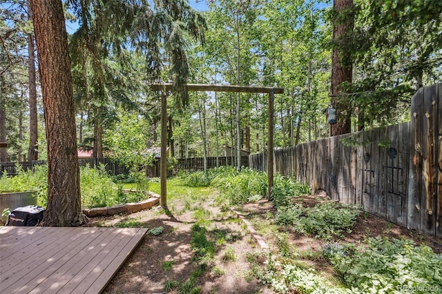 10990 Oehlman Ave, Conifer, CO 80433 - fenced backyard featuring a deck