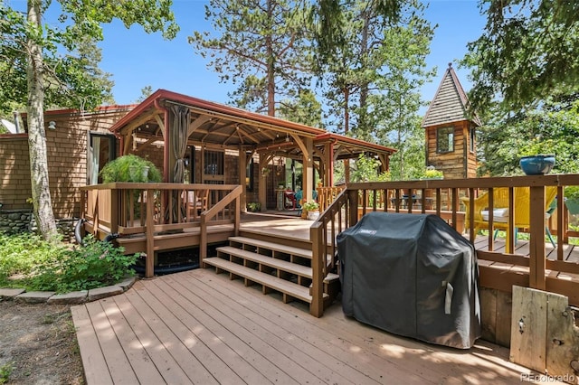 10990 Oehlman Ave, Conifer, CO 80433 - wooden terrace with area for grilling and a gazebo
