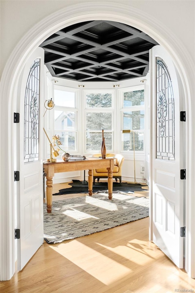 interior space featuring beamed ceiling and coffered ceiling